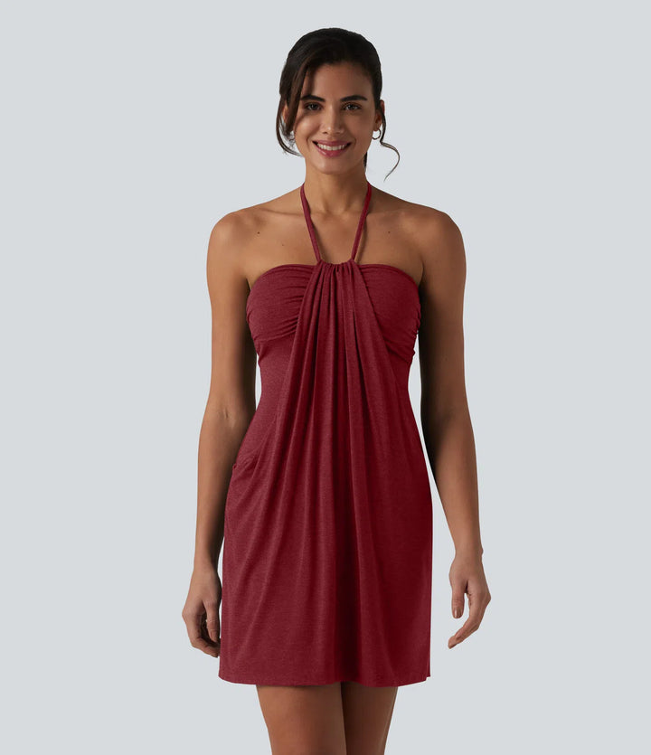 Robe resort mini dos nu à col licou avec lien noué dans le dos et poches