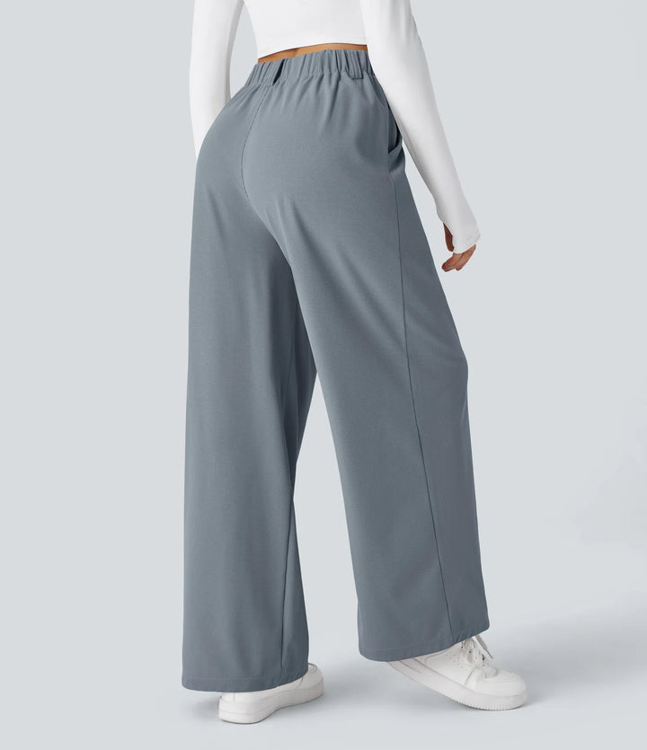 Pantalon fluide à taille haute et jambes larges, en tissu gaufré, avec poches latérales