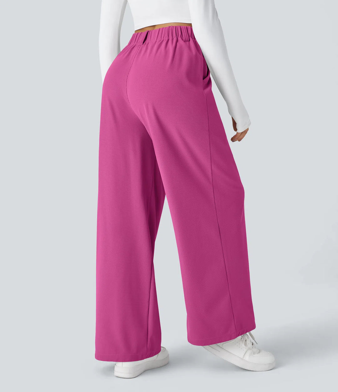Pantalon fluide à taille haute et jambes larges, en tissu gaufré, avec poches latérales