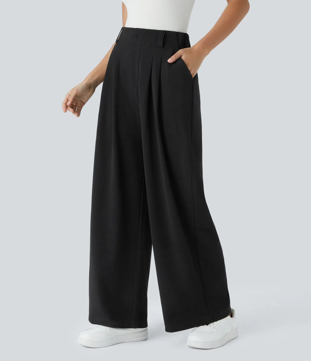 Pantalon fluide à taille haute et jambes larges, en tissu gaufré, avec poches latérales