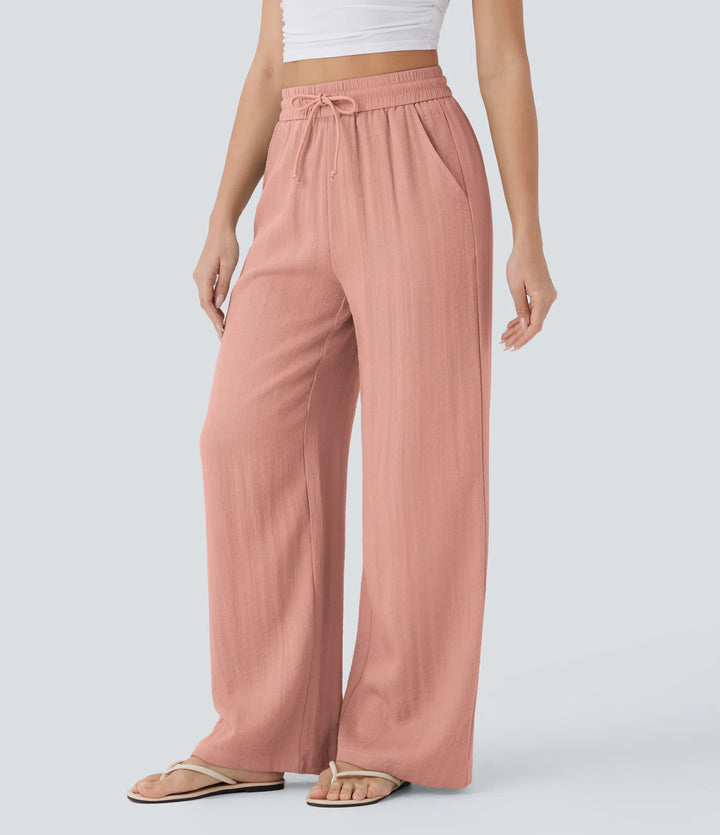 Pantalon large fluide taille haute avec cordon de serrage, poches latérales et aspect lin