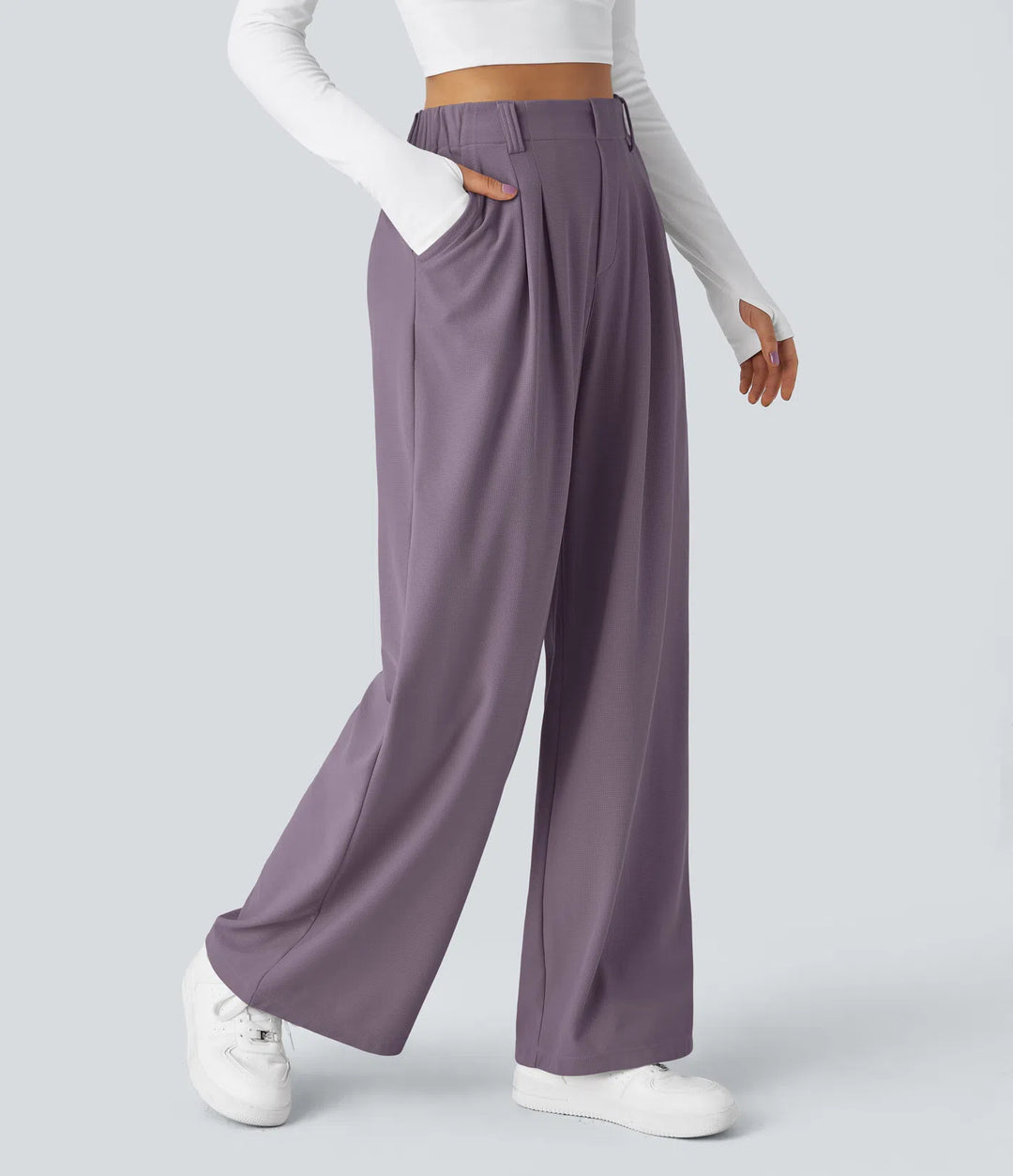 Pantalon fluide à taille haute et jambes larges, en tissu gaufré, avec poches latérales