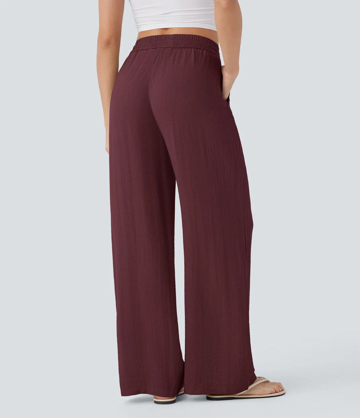 Pantalon large fluide taille haute avec cordon de serrage, poches latérales et aspect lin