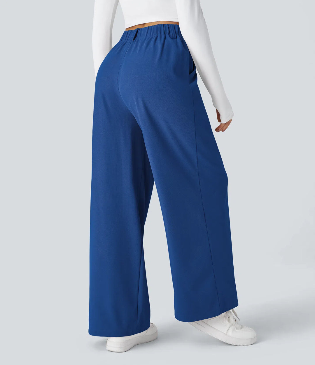 Pantalon fluide à taille haute et jambes larges, en tissu gaufré, avec poches latérales