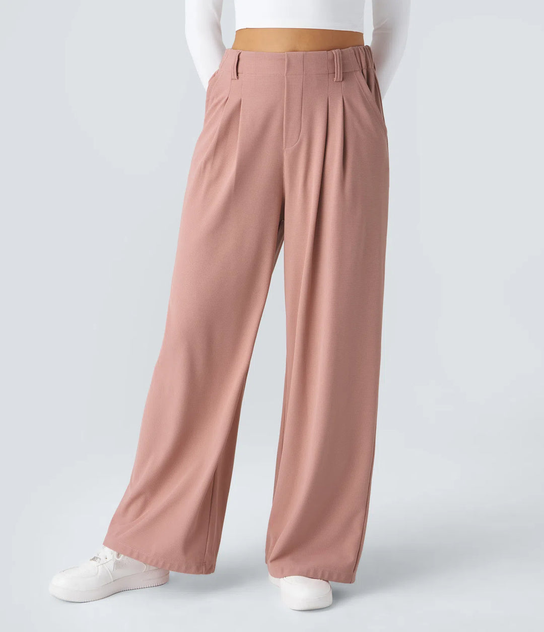 Pantalon fluide à taille haute et jambes larges, en tissu gaufré, avec poches latérales
