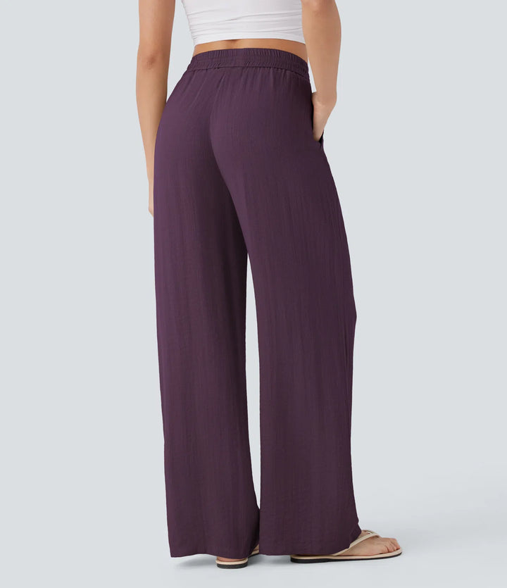 Pantalon large fluide taille haute avec cordon de serrage, poches latérales et aspect lin