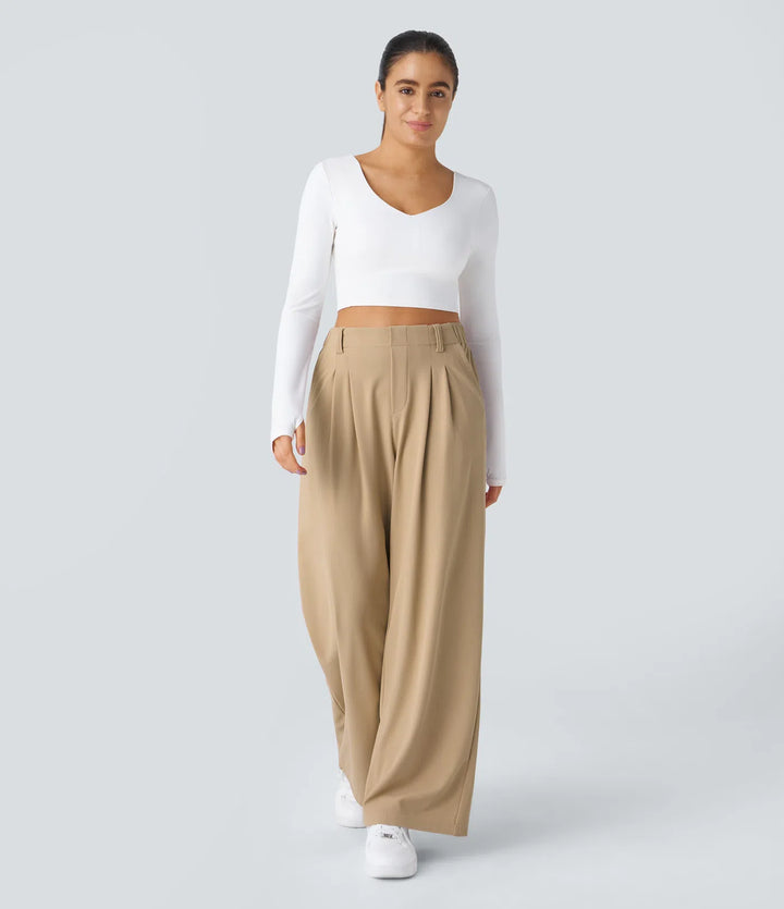 Pantalon fluide à taille haute et jambes larges, en tissu gaufré, avec poches latérales