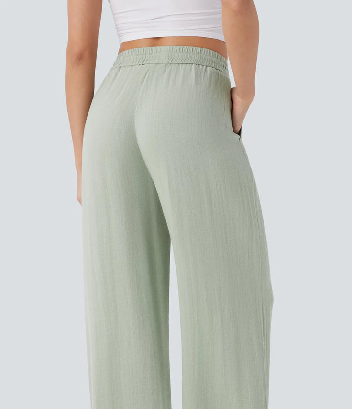 Pantalon large fluide taille haute avec cordon de serrage, poches latérales et aspect lin