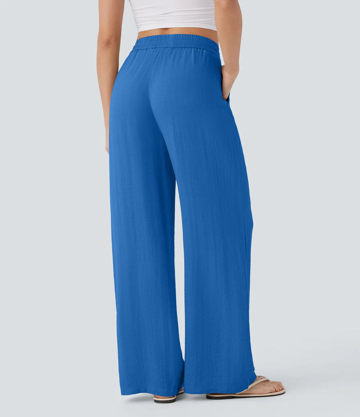 Pantalon large fluide taille haute avec cordon de serrage, poches latérales et aspect lin