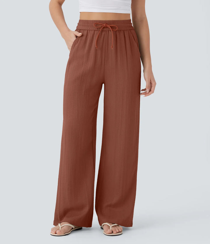Pantalon large fluide taille haute avec cordon de serrage, poches latérales et aspect lin