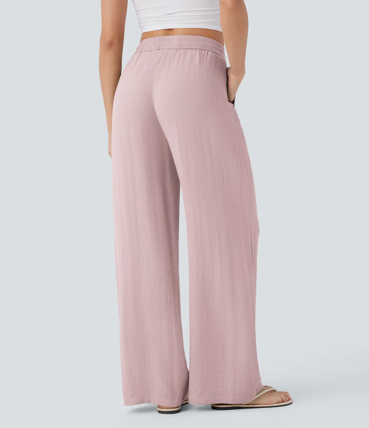 Pantalon large fluide taille haute avec cordon de serrage, poches latérales et aspect lin