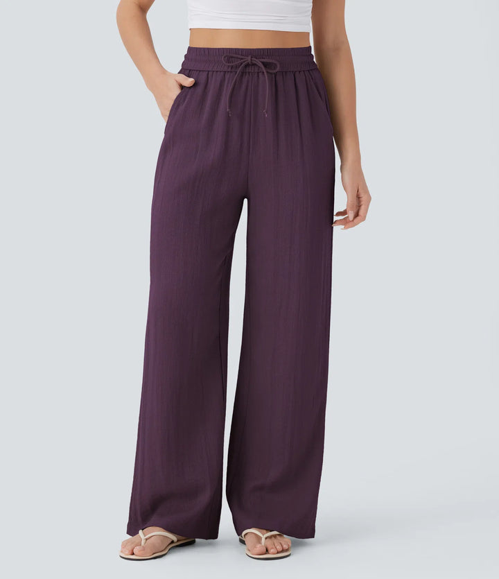 Pantalon large fluide taille haute avec cordon de serrage, poches latérales et aspect lin
