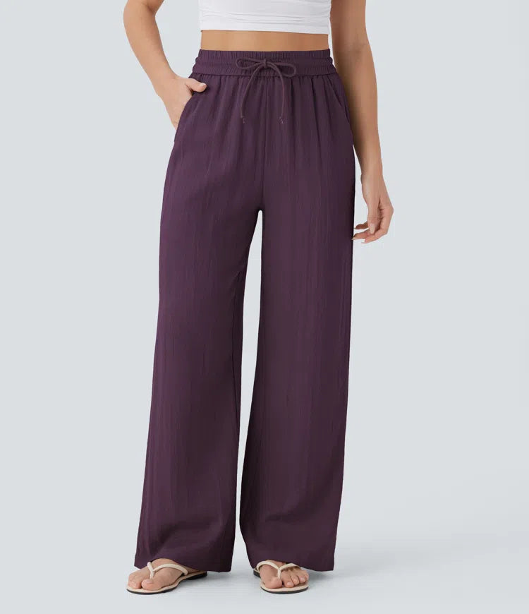 Pantalon large fluide taille haute avec cordon de serrage, poches latérales et aspect lin