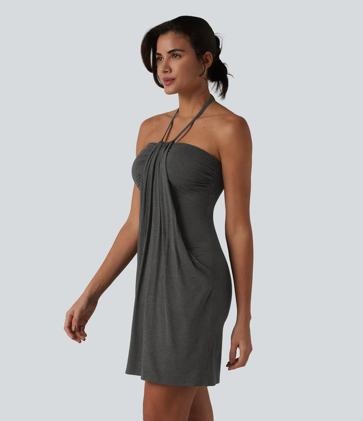 Robe resort mini dos nu à col licou avec lien noué dans le dos et poches
