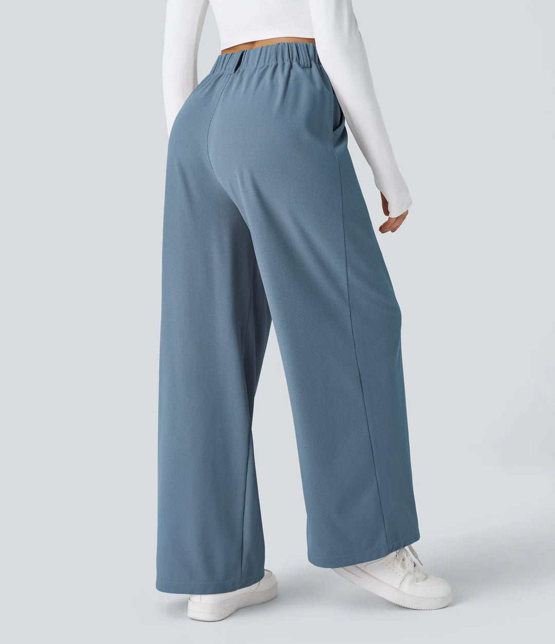 Pantalon fluide à taille haute et jambes larges, en tissu gaufré, avec poches latérales