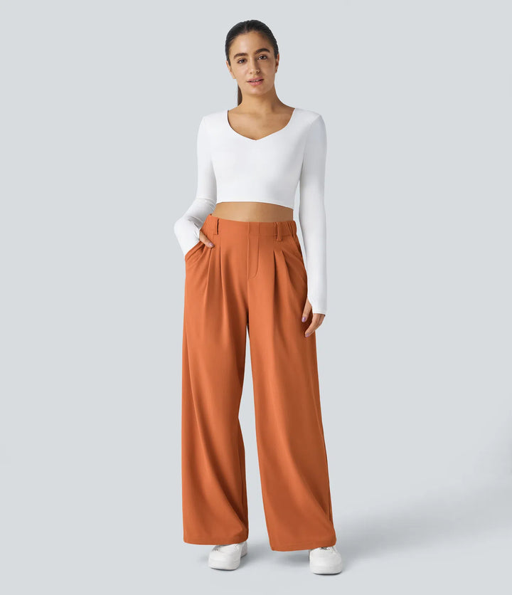 Pantalon fluide à taille haute et jambes larges, en tissu gaufré, avec poches latérales