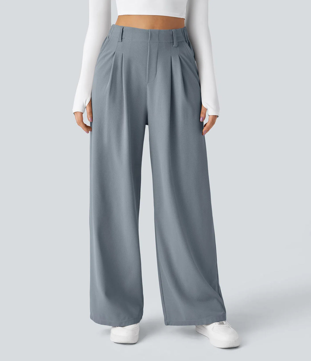 Pantalon fluide à taille haute et jambes larges, en tissu gaufré, avec poches latérales