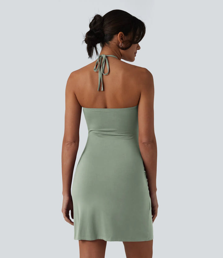 Robe resort mini dos nu à col licou avec lien noué dans le dos et poches