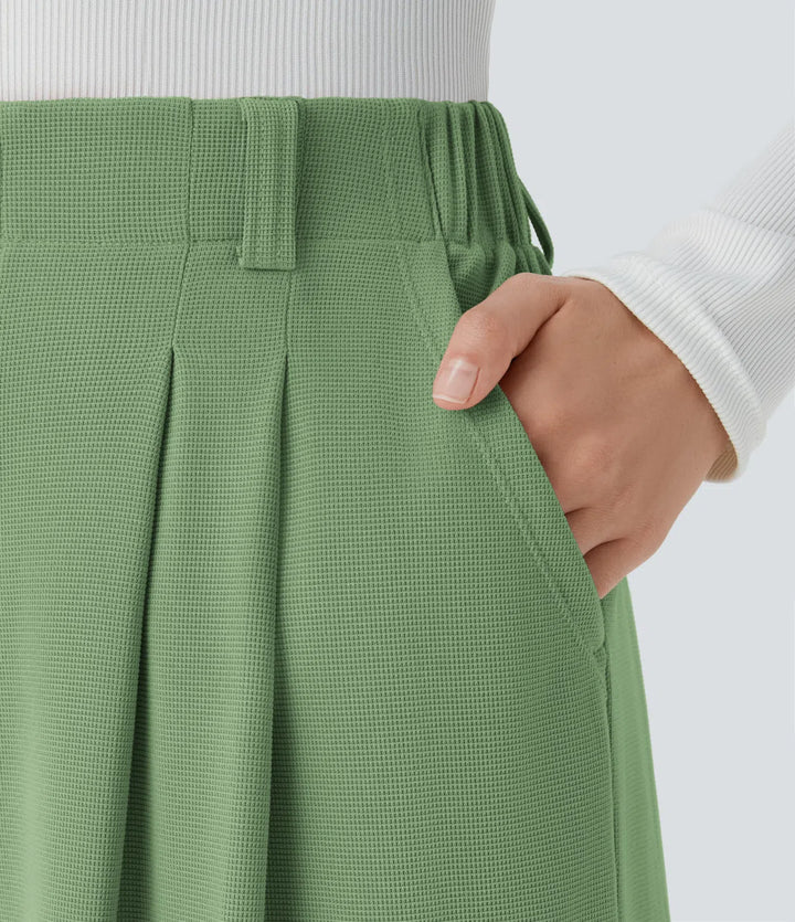 Pantalon fluide à taille haute et jambes larges, en tissu gaufré, avec poches latérales