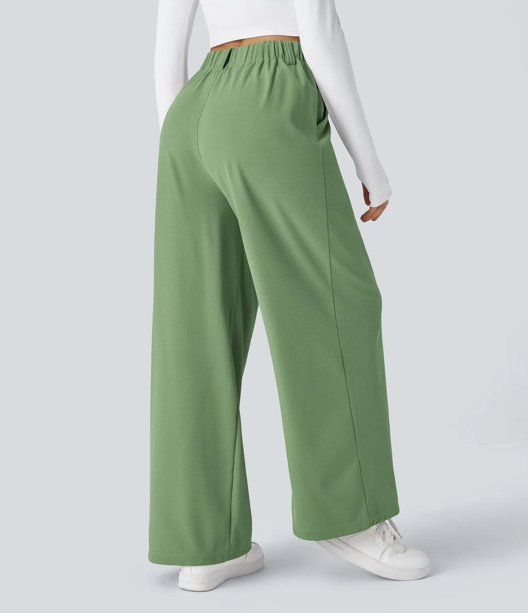 Pantalon fluide à taille haute et jambes larges, en tissu gaufré, avec poches latérales