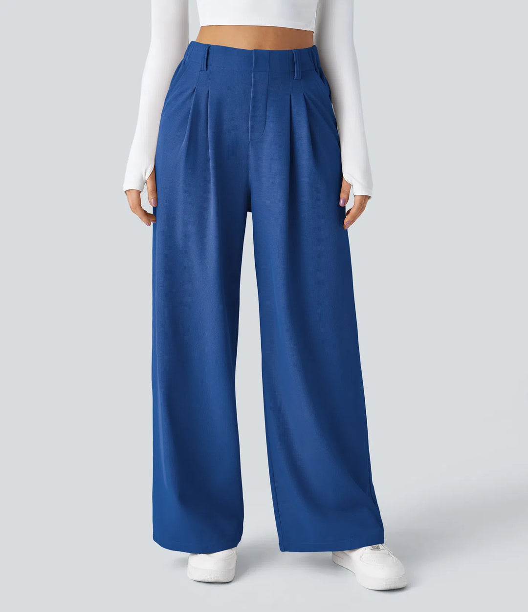 Pantalon fluide à taille haute et jambes larges, en tissu gaufré, avec poches latérales