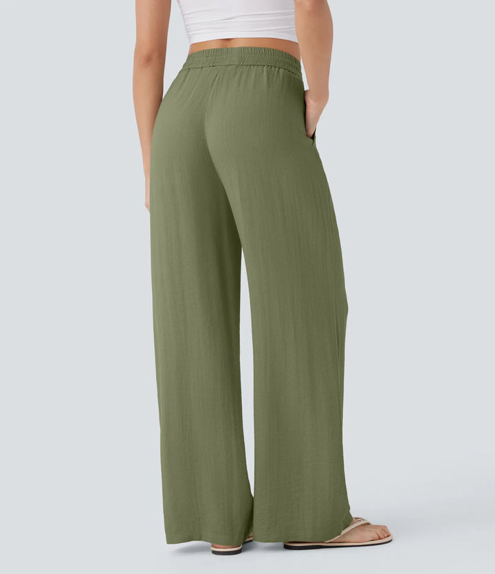 Pantalon large fluide taille haute avec cordon de serrage, poches latérales et aspect lin