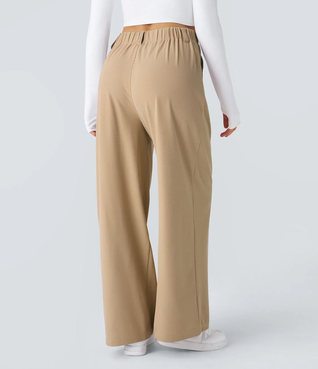 Pantalon fluide à taille haute et jambes larges, en tissu gaufré, avec poches latérales