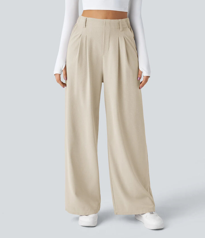 Pantalon fluide à taille haute et jambes larges, en tissu gaufré, avec poches latérales