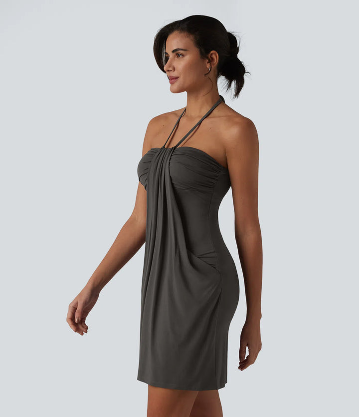Robe resort mini dos nu à col licou avec lien noué dans le dos et poches
