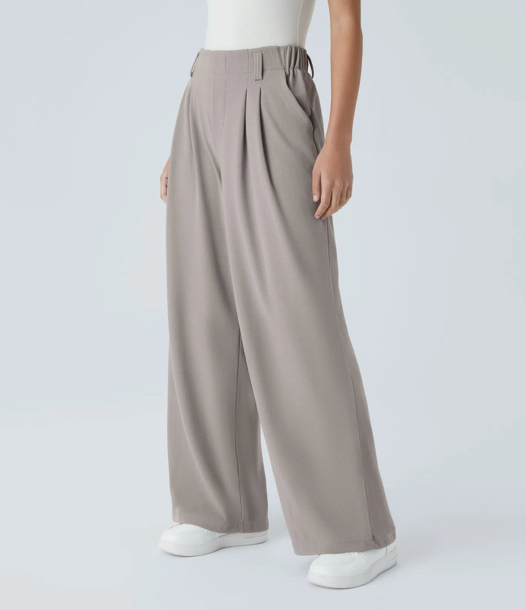 Pantalon fluide à taille haute et jambes larges, en tissu gaufré, avec poches latérales