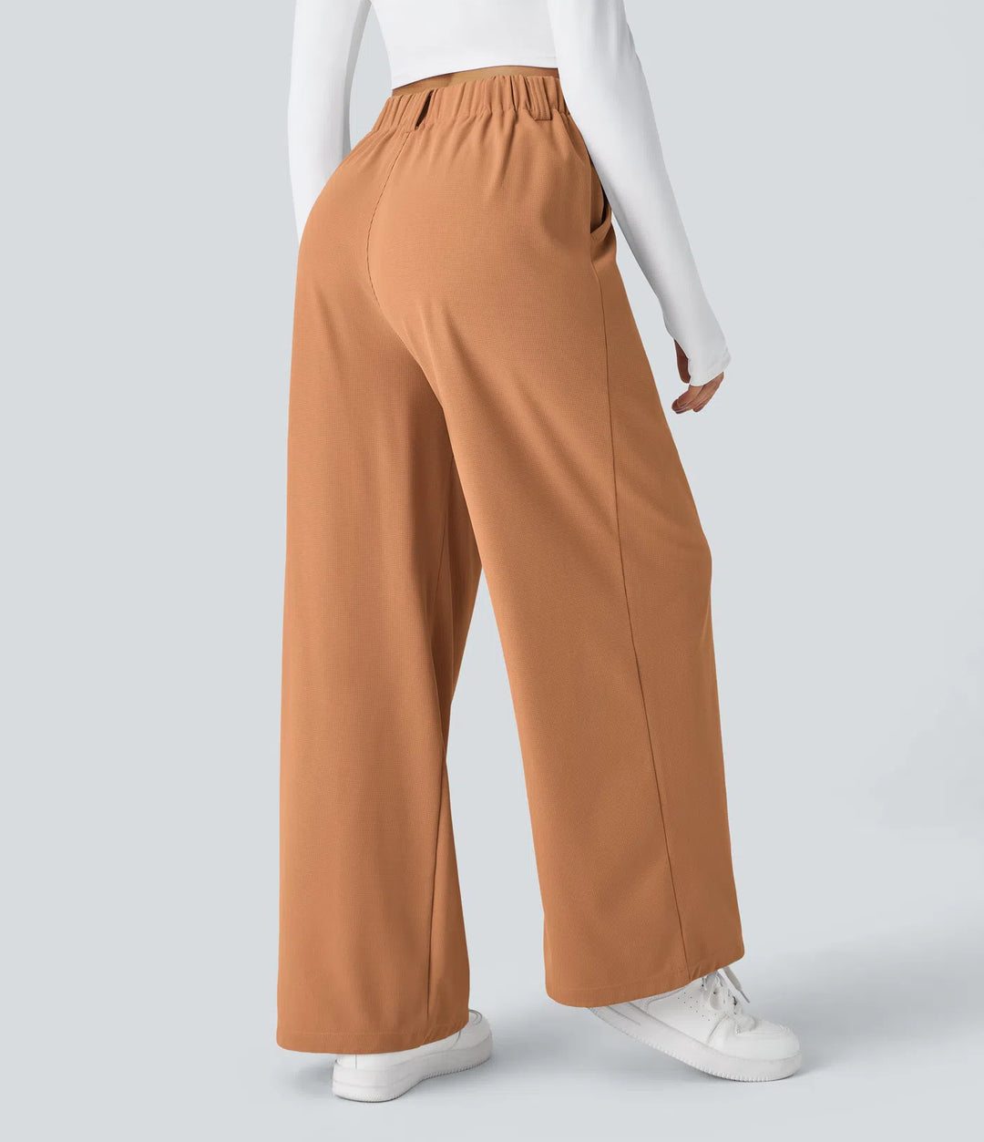 Pantalon fluide à taille haute et jambes larges, en tissu gaufré, avec poches latérales