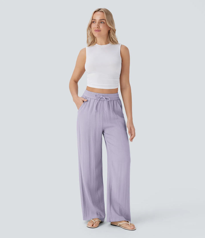 Pantalon large fluide taille haute avec cordon de serrage, poches latérales et aspect lin