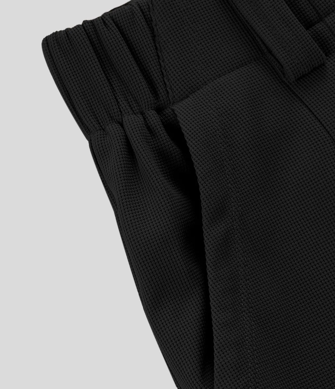 Pantalon fluide à taille haute et jambes larges, en tissu gaufré, avec poches latérales
