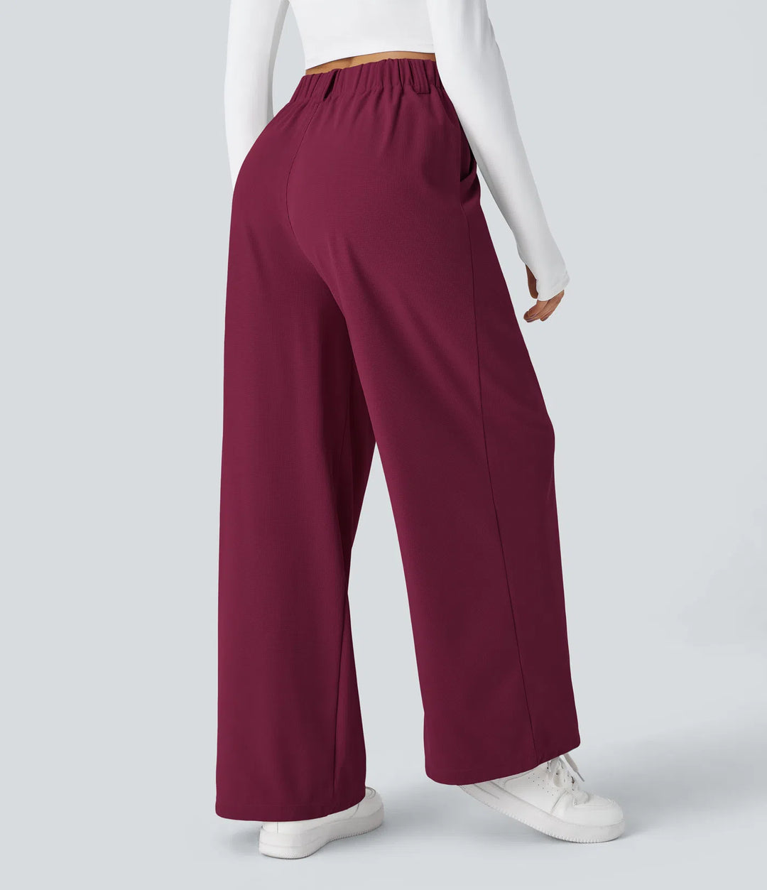 Pantalon fluide à taille haute et jambes larges, en tissu gaufré, avec poches latérales