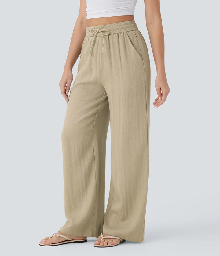 Pantalon large fluide taille haute avec cordon de serrage, poches latérales et aspect lin