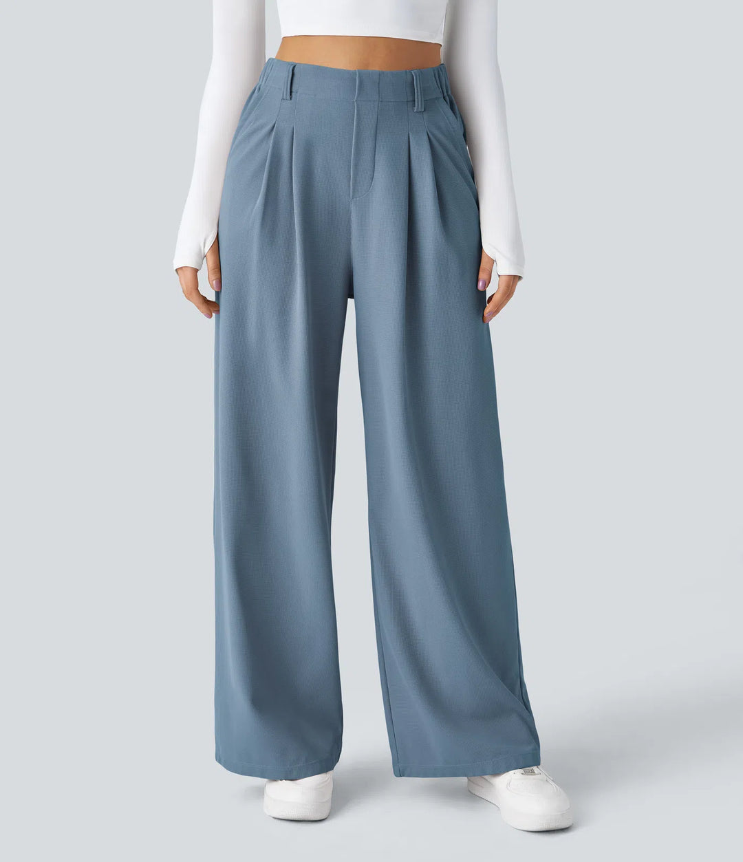 Pantalon fluide à taille haute et jambes larges, en tissu gaufré, avec poches latérales
