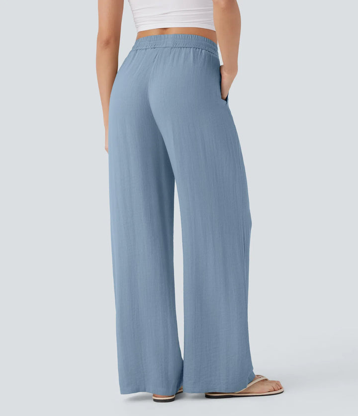 Pantalon large fluide taille haute avec cordon de serrage, poches latérales et aspect lin