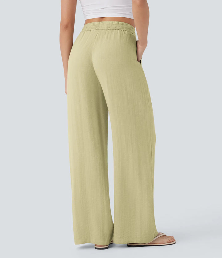 Pantalon large fluide taille haute avec cordon de serrage, poches latérales et aspect lin
