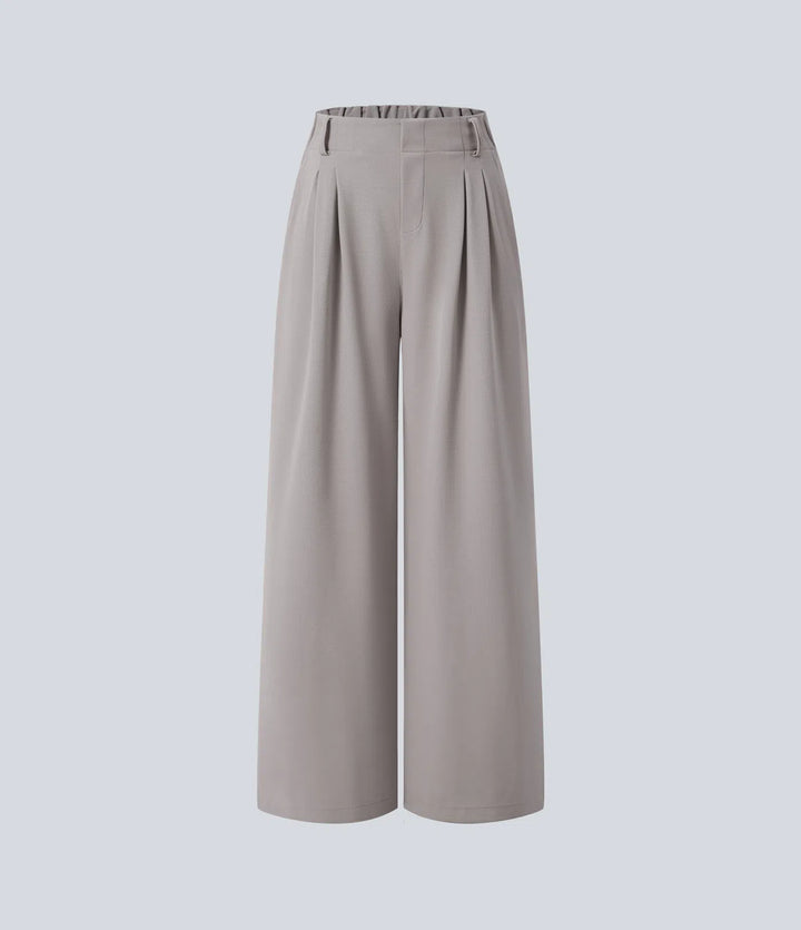 Pantalon fluide à taille haute et jambes larges, en tissu gaufré, avec poches latérales