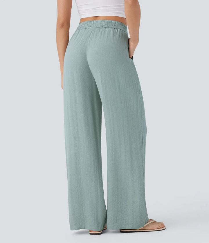 Pantalon large fluide taille haute avec cordon de serrage, poches latérales et aspect lin
