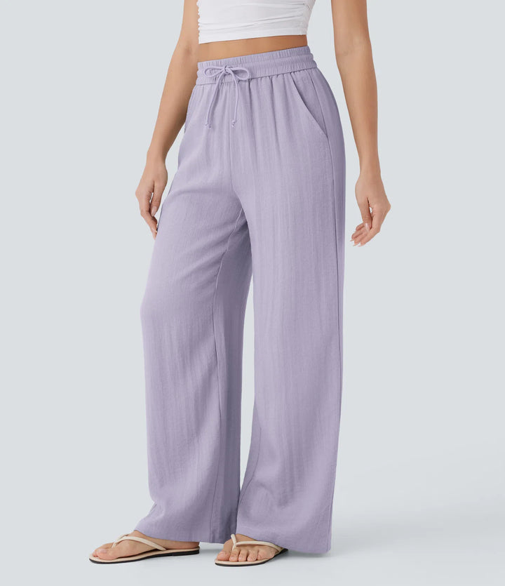 Pantalon large fluide taille haute avec cordon de serrage, poches latérales et aspect lin