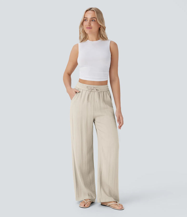 Pantalon large fluide taille haute avec cordon de serrage, poches latérales et aspect lin