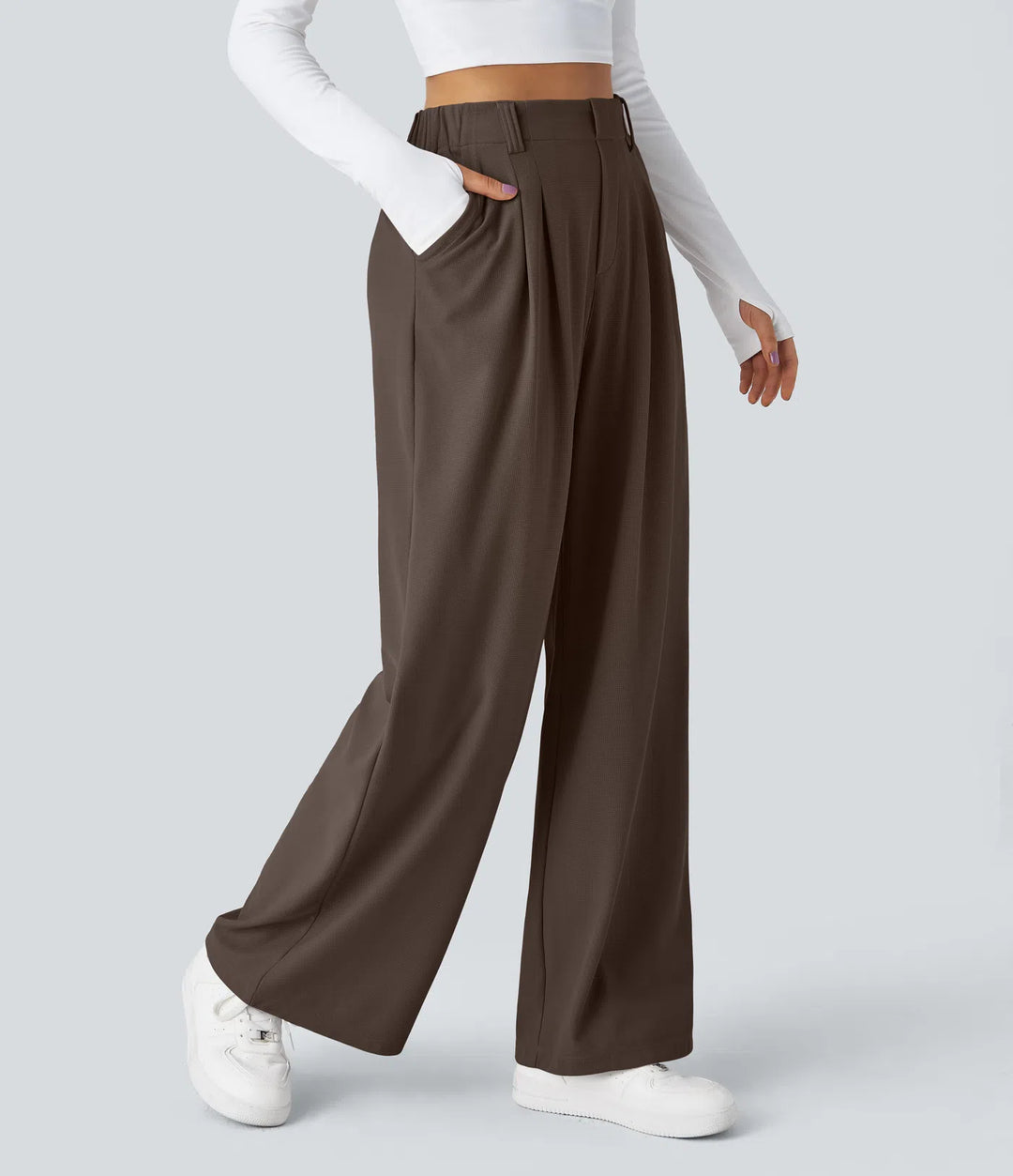 Pantalon fluide à taille haute et jambes larges, en tissu gaufré, avec poches latérales