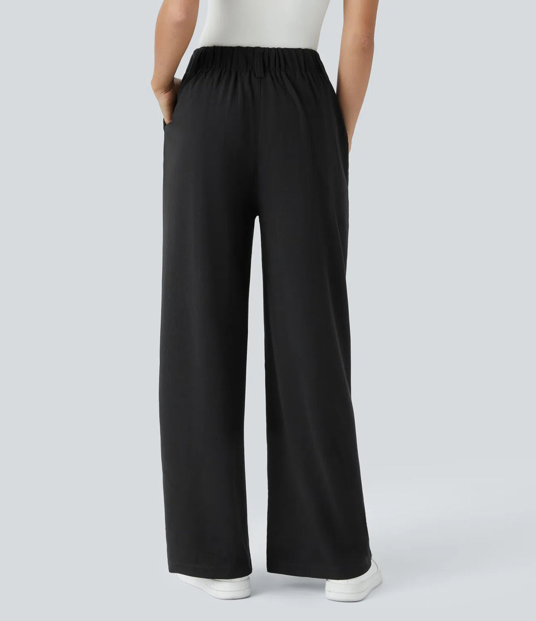 Pantalon fluide à taille haute et jambes larges, en tissu gaufré, avec poches latérales