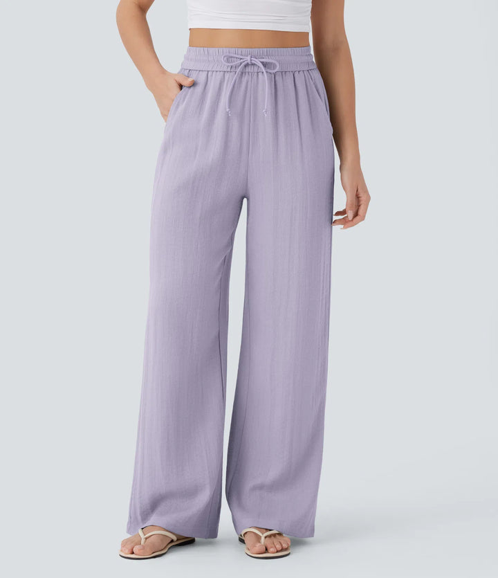Pantalon large fluide taille haute avec cordon de serrage, poches latérales et aspect lin