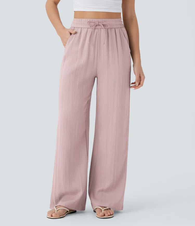 Pantalon large fluide taille haute avec cordon de serrage, poches latérales et aspect lin