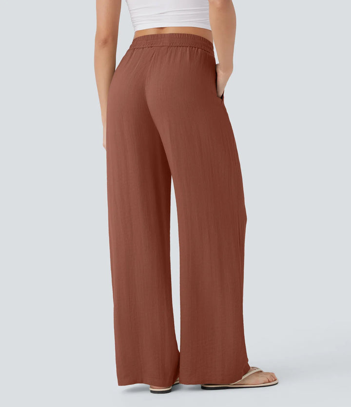 Pantalon large fluide taille haute avec cordon de serrage, poches latérales et aspect lin