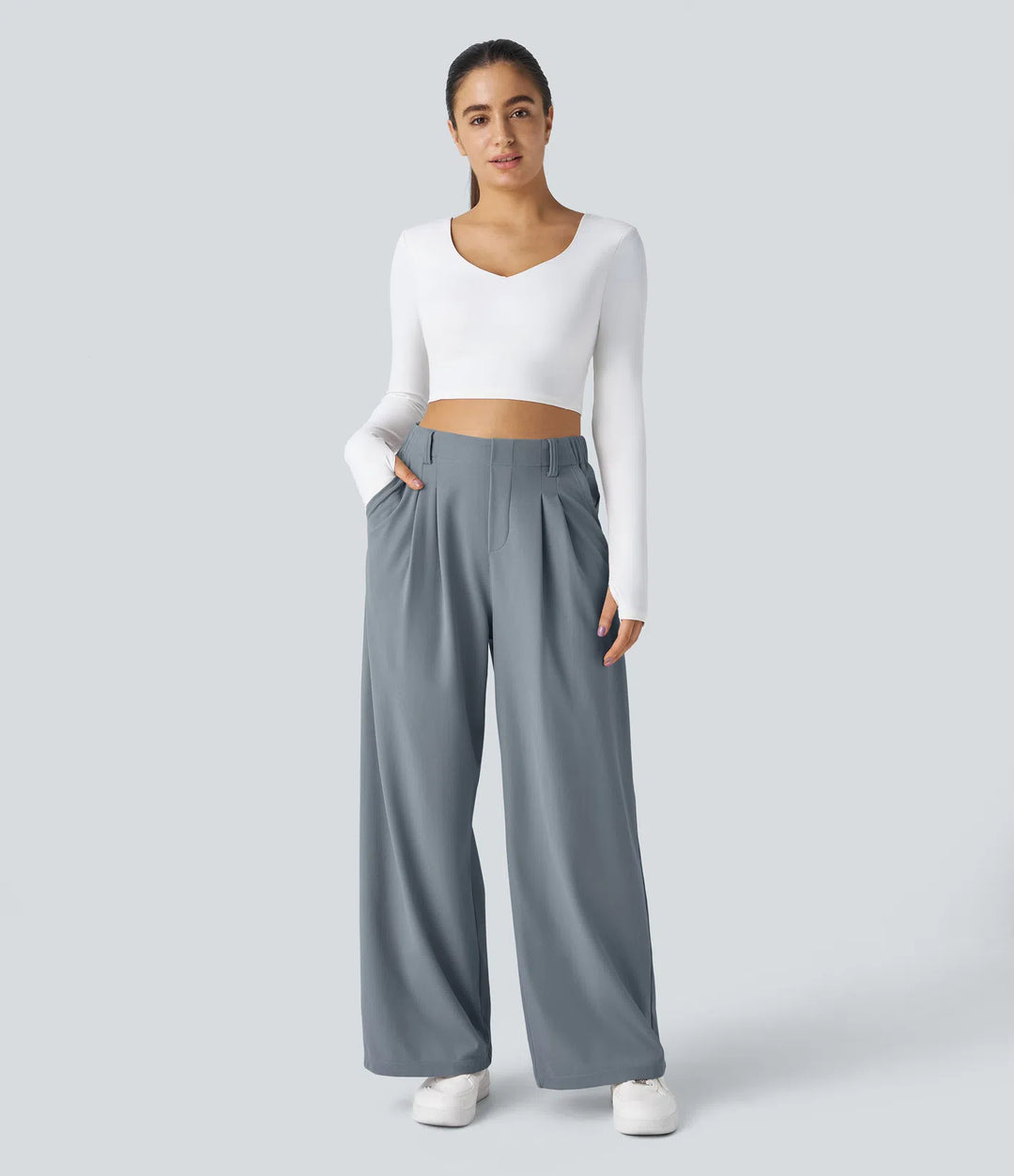 Pantalon fluide à taille haute et jambes larges, en tissu gaufré, avec poches latérales