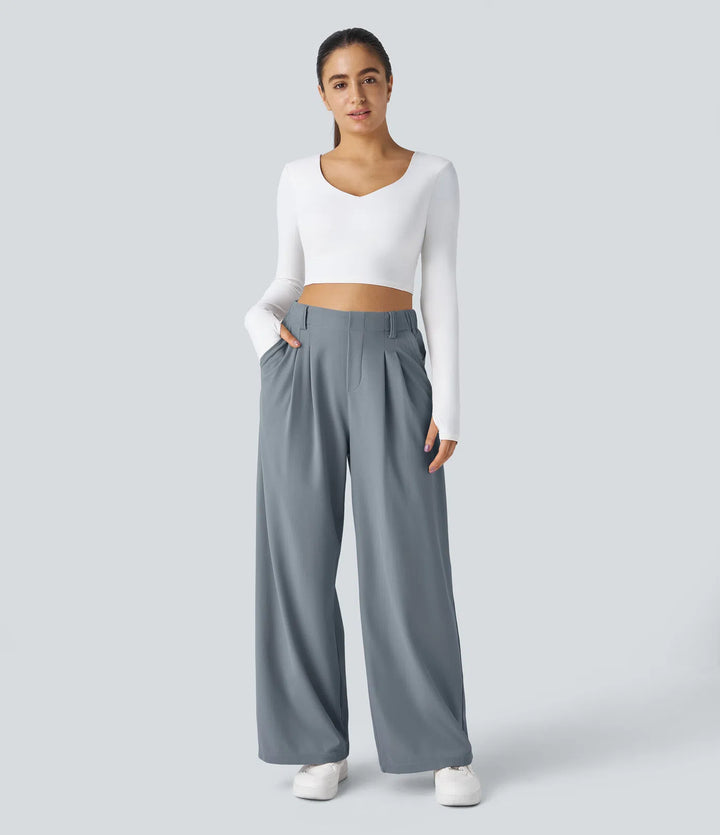 Pantalon fluide à taille haute et jambes larges, en tissu gaufré, avec poches latérales