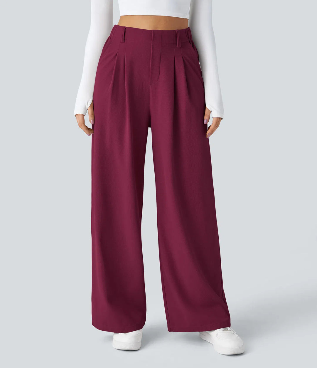 Pantalon fluide à taille haute et jambes larges, en tissu gaufré, avec poches latérales